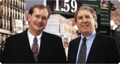 An Image of two man stand in store