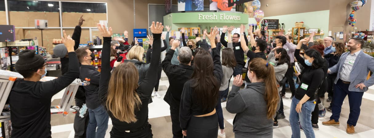 An image representing a supermarket worker celebrating some occassion