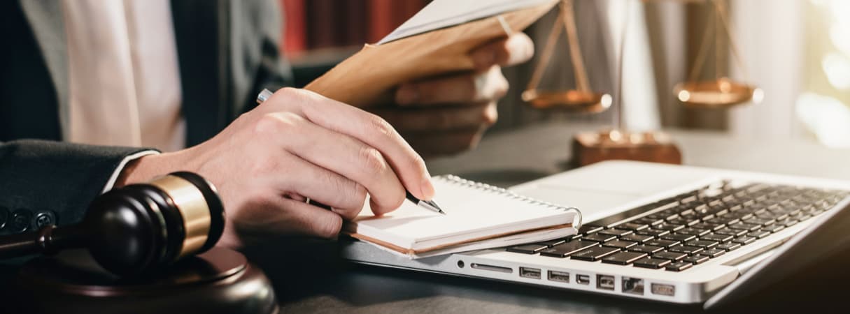 An image of man writing on paper