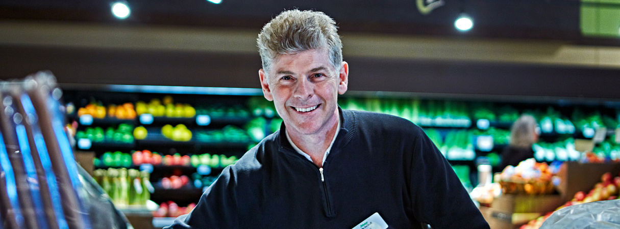 An image of a man working in a sobeys store.